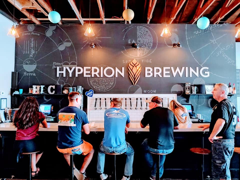 People sitting at the bar at Hyperion Brewing Company in Springfield Jacksonville