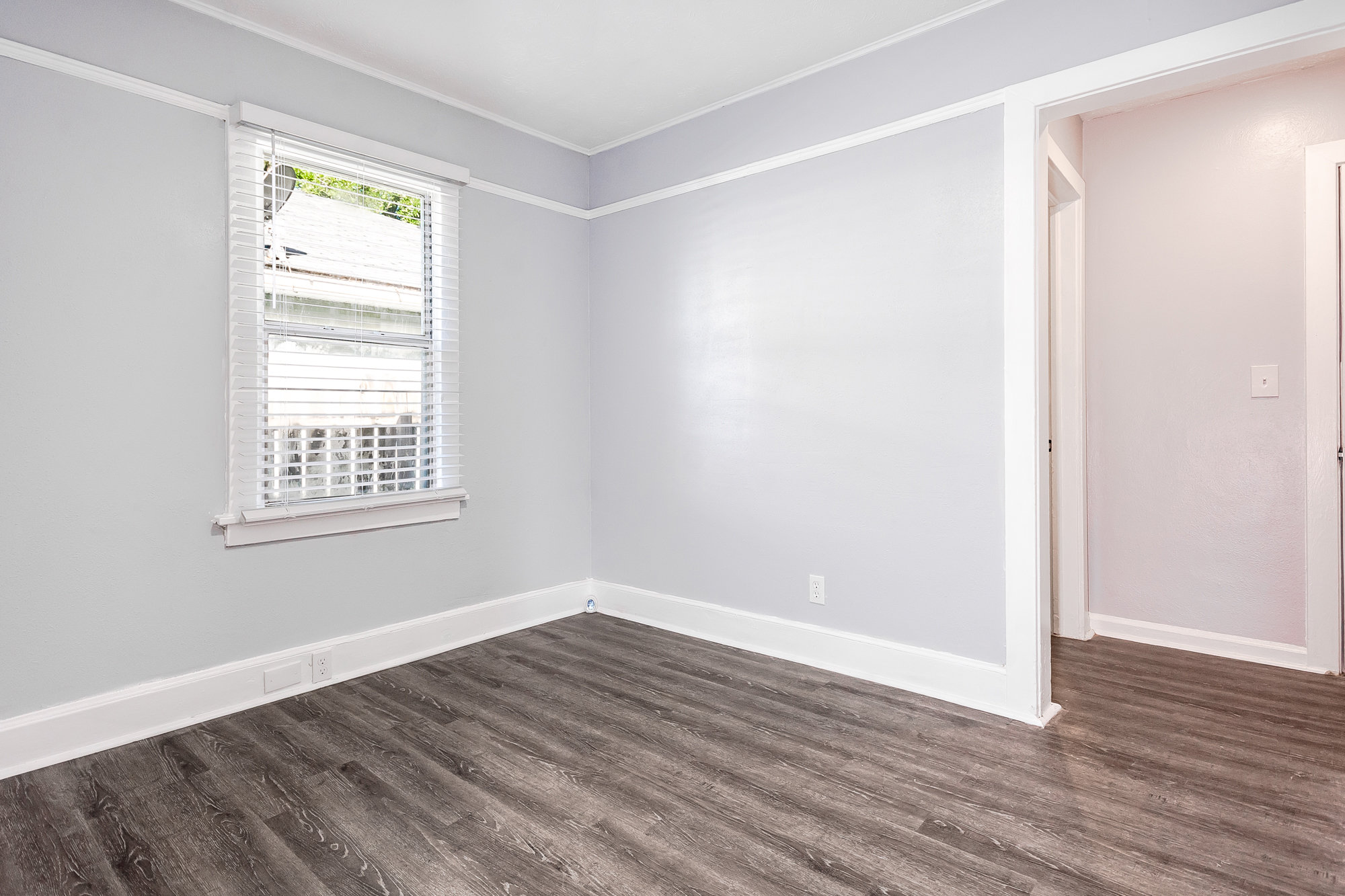 Bedroom with netural colors and updated floors